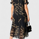 Jillian Vestido Caftán Negro con Estampado Abstracto en Oro y Escote en V